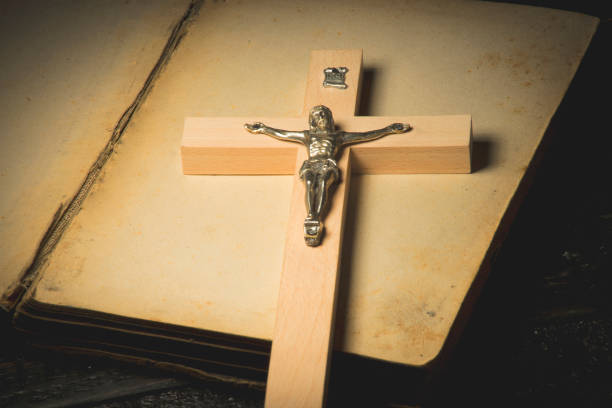 istock A crucifix against the background of an open book 1065586510