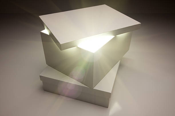 Gift box with glowing lights on wood.