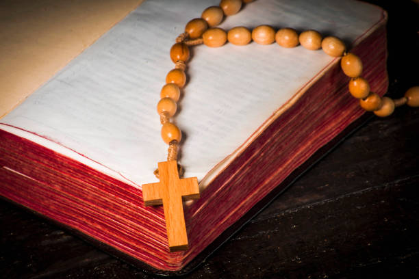 istock Rosary against the background of an open book 1065588244
