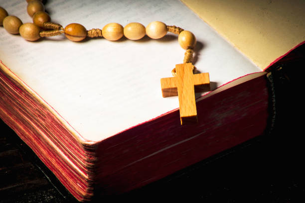 istock Rosary against the background of an open book 1065588376