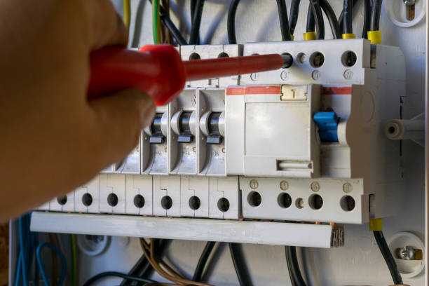 istock Electrical equipment. screwdriver in the hands. 1065591114