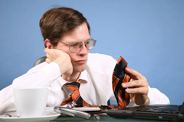 istock Boring Businessman playing with his necktie 106559341