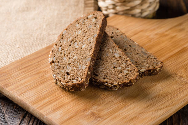 istock Wholegrain bread with seeds on the wood, overhead horizontal view 1065595130