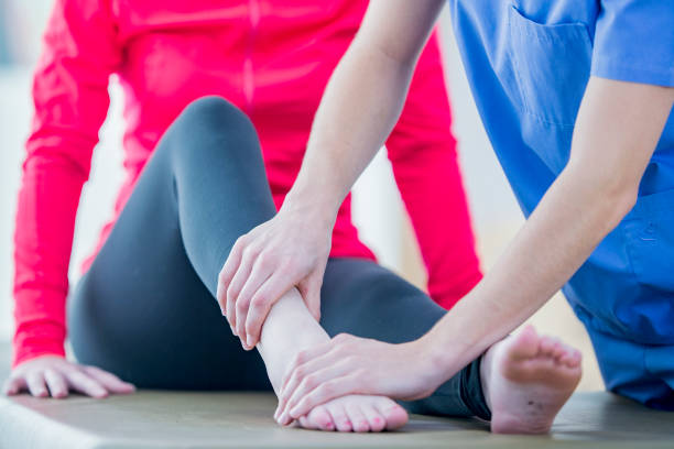 istock A physiotherapist treats a woman's injured ankle 1065600152