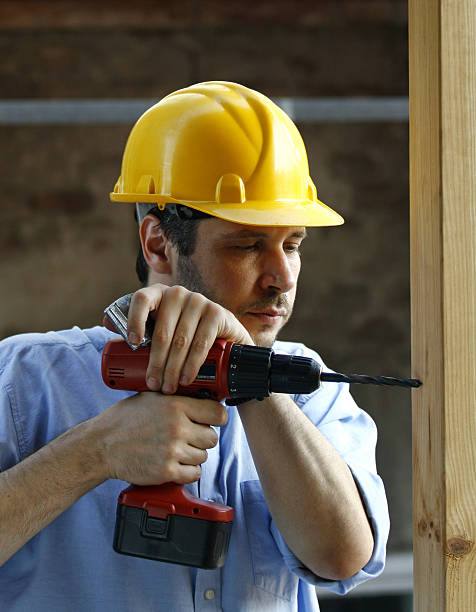 istock Man worker with hard hat drilling wood 106560488
