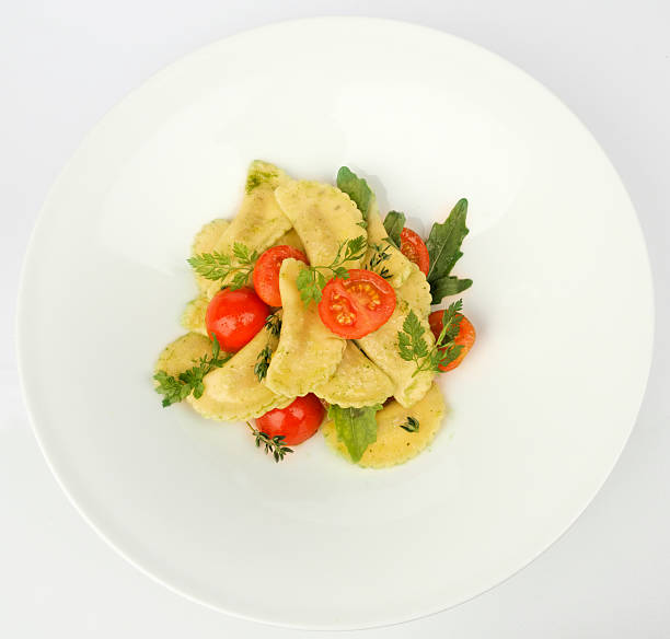pasta ravioli with pesto - food stock photo