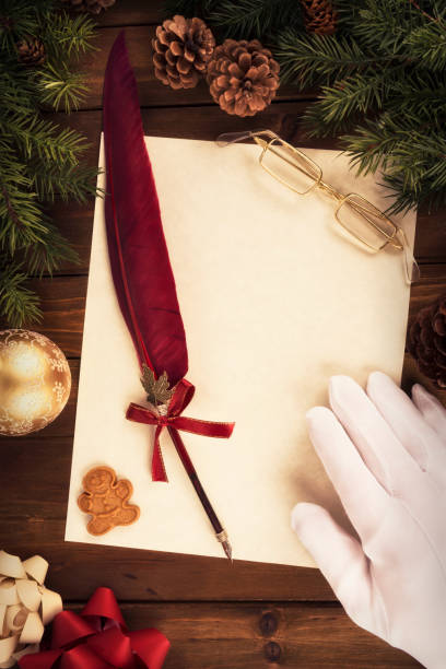 istock Santa Claus writing a letter, directly above. 1065610330