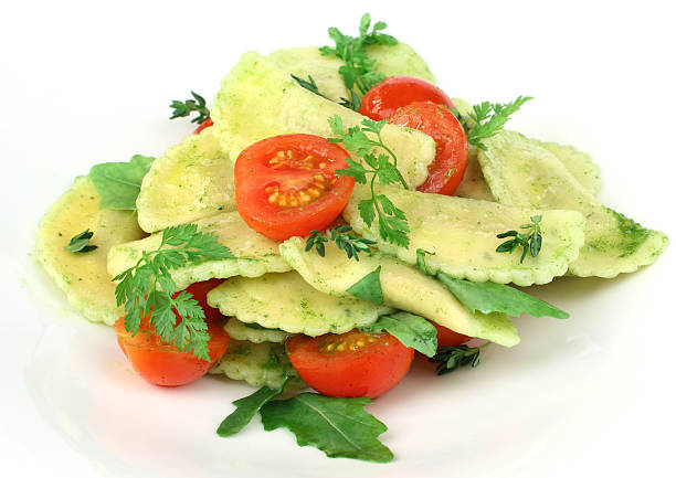 Pasta ravioli with pesto - food stock photo