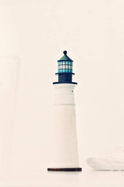 istock wooden mock-up of a white lighthouse with a blue dome 1065613408
