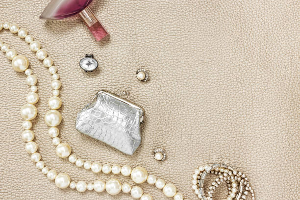 Silver purse, jewelry and perfume. Beauty and fashion composition with copy space.