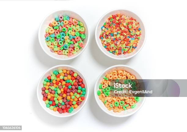 Bowls Of Different Colorful Cereal On A White Background Stock Photo - Download Image Now