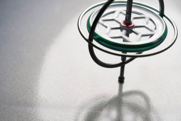 istock Gyroscope toy that is spinning keeping balance for spin concept 1065628250