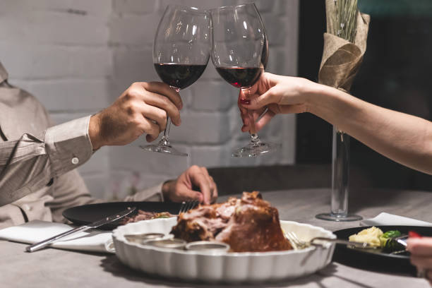 Man and woman dining in restaurant.