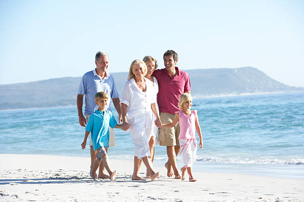 istock Three Generation Family At Holiday Walking On Beach 106564650