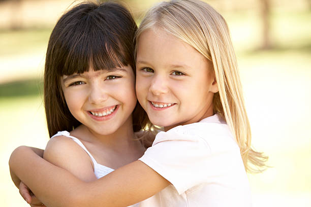 istock Young Girls Giving Each Other Hug 106564696