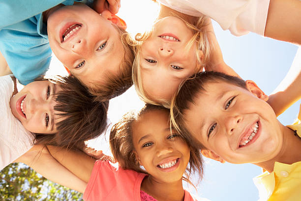 istock Young smiling children in a circle looking down 106564911