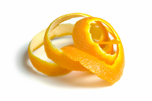 Fresh tangerine peel closeup isolated on white background
