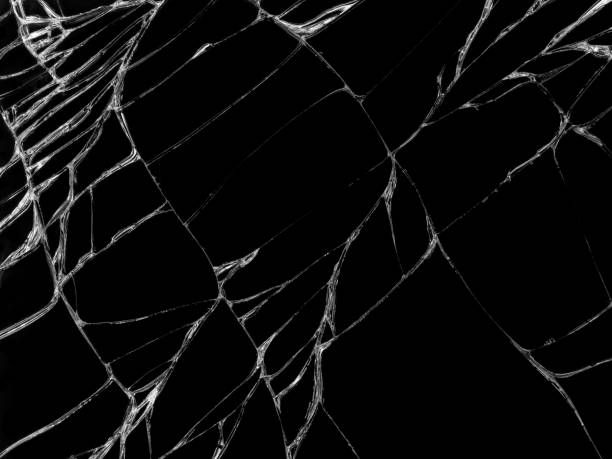 istock Cracked glass texture on black background 1065674078