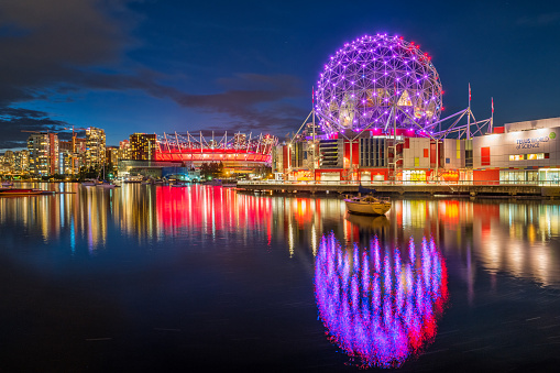 Science World and BC Place Stadium in Vancouver British Columbia Canada illuminated  in the evening.