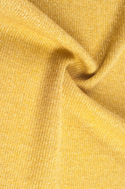 istock Texture, background, pattern. Fabric of a golden hue. Bronze Shade Scale Mermaid Sequin Fabric by Yard Light Golden 1065689300