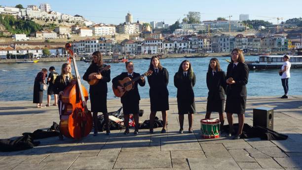 Porto, Portugal - circa October 2018:Young Students music band at the douro river