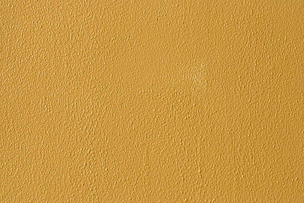 Vibrant Yellow Painted Wall stock photo