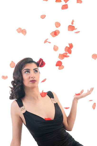 Middle asian girl with rose petals stock photo