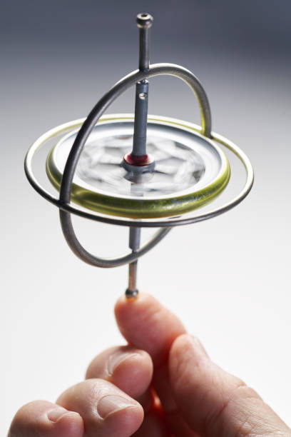 istock Gyroscope toy that is spinning on hand finger keeping balance for spin concept 1065695750