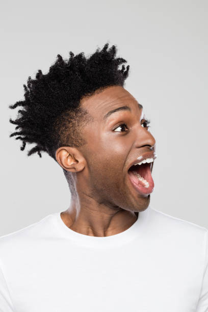 istock Excited afro american man looking away and laughing 1065697382