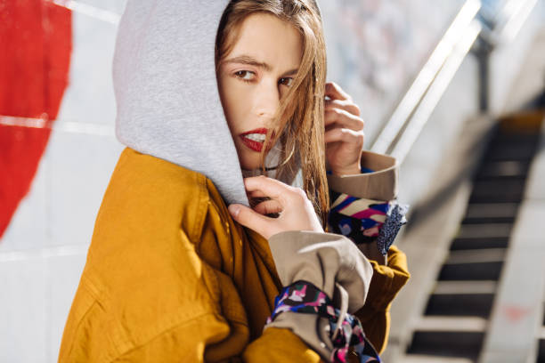 istock Dark-eyed young photo model with pleasant appearance working outside 1065697434