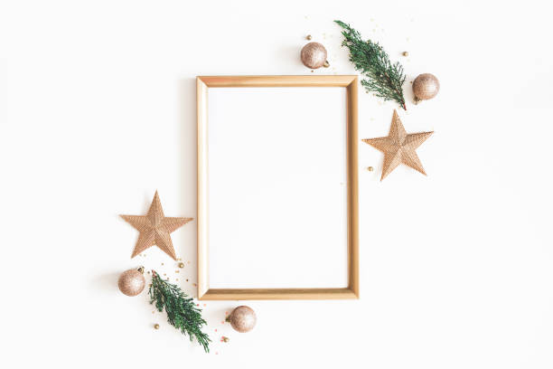 istock Christmas composition. Photo frame, golden decorations, fir tree branches on white background. Christmas, winter, new year concept. Flat lay, top view, copy space 1065697460