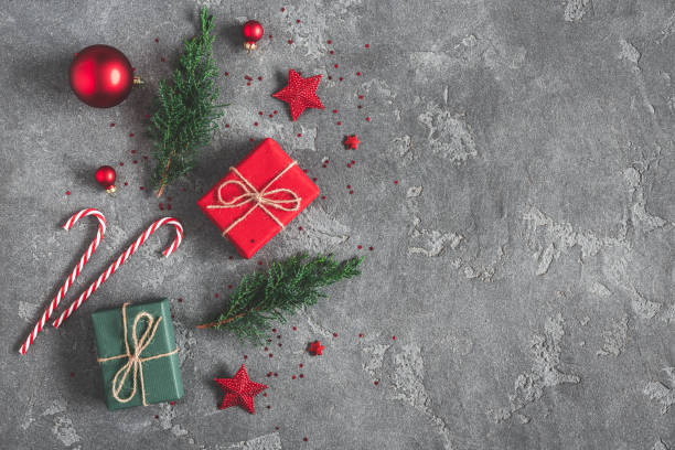 istock Christmas composition. Gifts, fir tree branches, red decorations on black background. Christmas, winter, new year concept. Flat lay, top view, copy space 1065697464