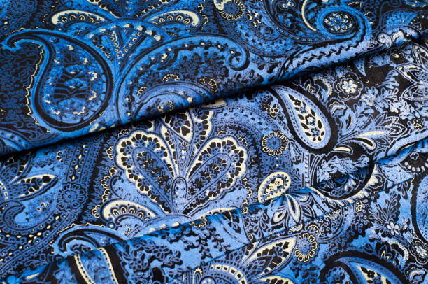 istock Background texture, Fabric blue paisley. Designed for Fabri-Quilt, this soft double napped  flannel is perfect for quilting, apparel, and home decor accents. Colors include black, blue, and white. 1065697546