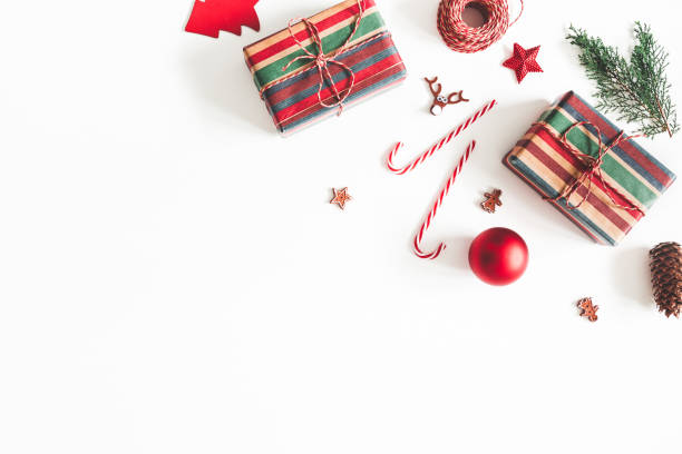 istock Christmas composition. Christmas gifts, fir tree branches, decorations on white background. Flat lay, top view, copy space 1065697922
