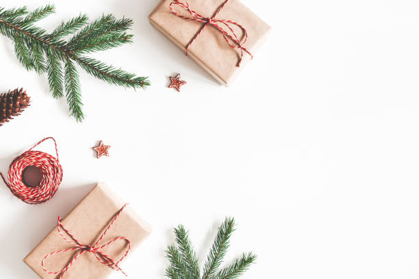 istock Christmas composition. Christmas gifts, fir tree branches, decorations on white background. Flat lay, top view, copy space 1065699044