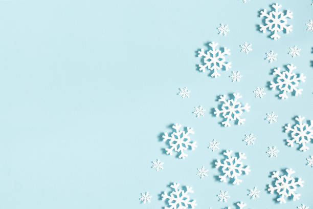 istock Christmas or winter composition. Pattern made of snowflakes on pastel blue background. Christmas, winter, new year concept. Flat lay, top view, copy space 1065699068