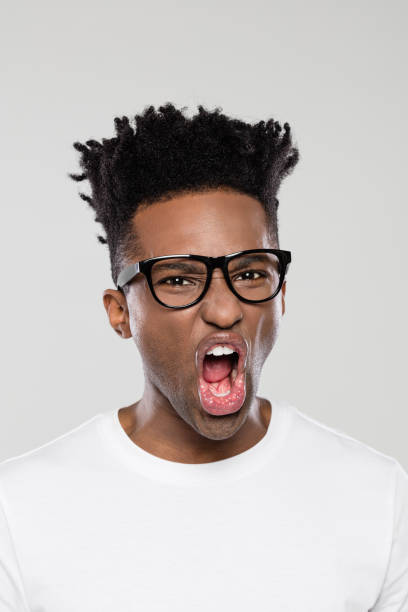 istock Excited afro american man on gray background 1065699078