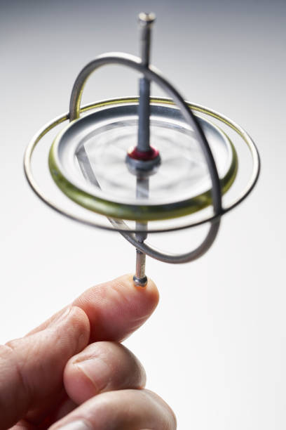 istock Gyroscope toy that is spinning on hand finger keeping balance for spin concept 1065699102