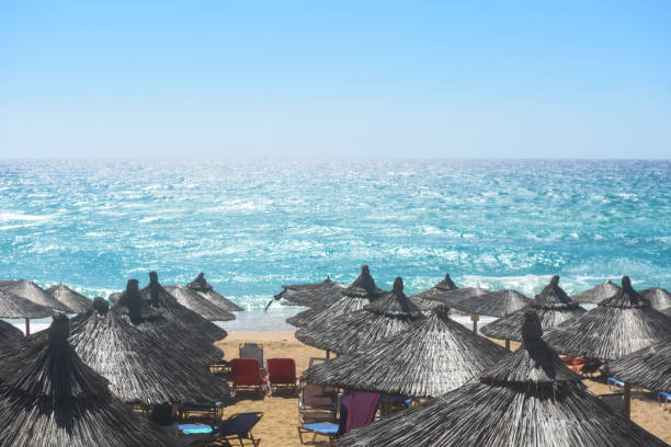 istock Beach umbrellas and sunbeds on Greece 1065700778