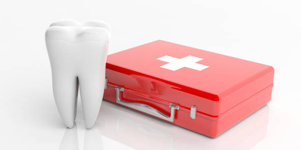 istock First aid kit and a tooth model isolated on white background. 3d illustration 1065706710