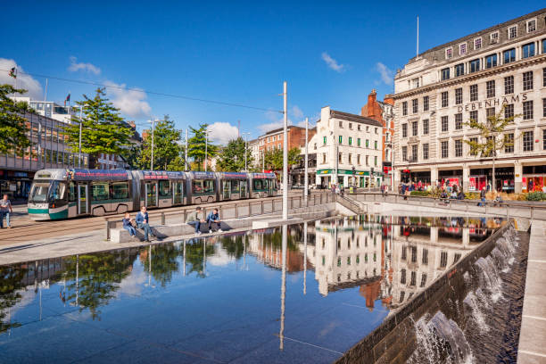 Nottingham Market Square, UK 2 October 2016: Nottingham, UK - Market Square, with Debenhams department store and a tram, on a beautiful autumn day. nottingham stock pictures, royalty-free photos & images