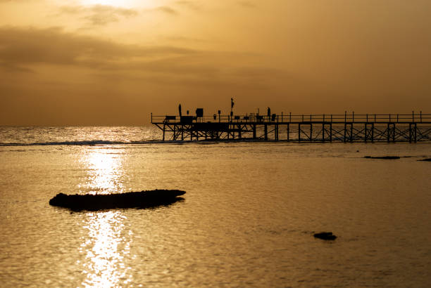 istock Red Sea Egypt - Pier above the Coral Reef at Sunset 1065714872