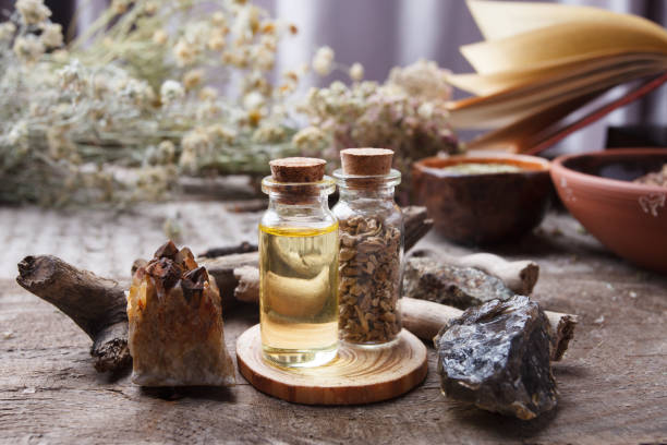 istock mystic still life with old book, amulets, stone, bottles. Witchcraft composition. Halloween and occult concept, magic ritual. mystical and homeopathic 1065722158