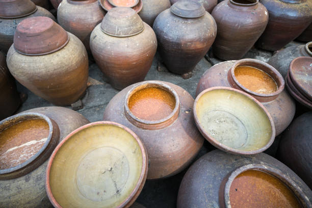 istock Jars of processing soybean jam made by traditional outdoor way under natural sunlight 1065722202