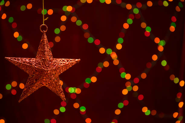 istock star shaped decoration on the colorful lights bokeh background. 1065724196