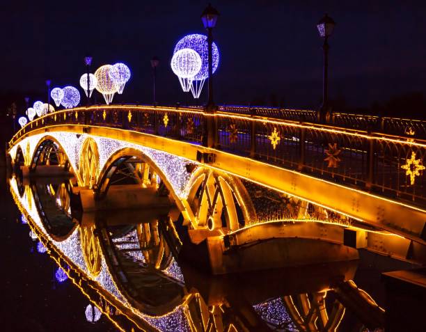 istock Illuminated arch bridge wth water reflections in night Moscow 1065725548