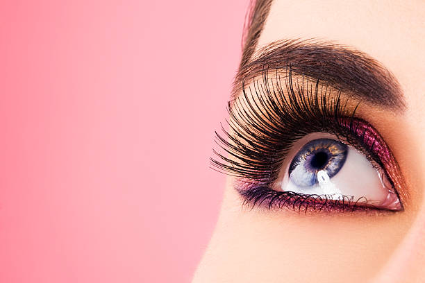 Woman eye with long eyelashes Woman eye with long eyelashes. Space for text. eyeshadow photos stock pictures, royalty-free photos & images
