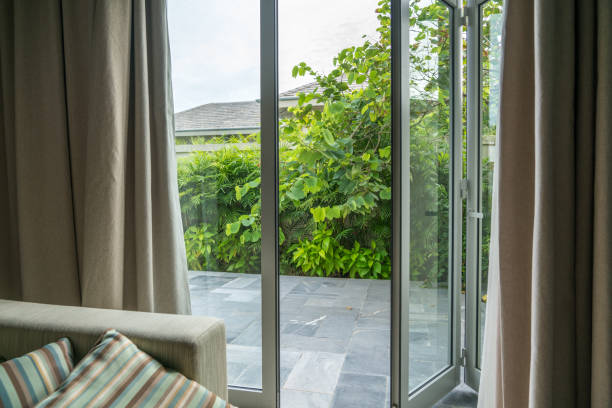 istock Open window in tropical villa. Summer garden, view outdoor 1065727766