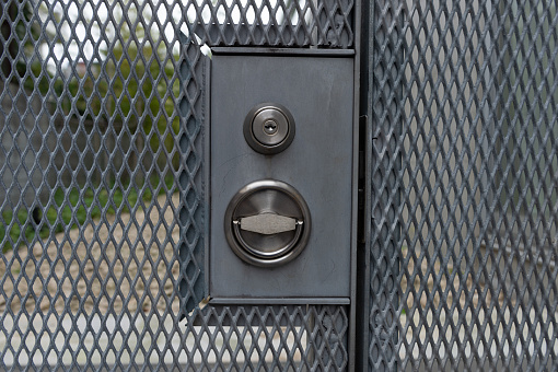 chain link fence and metal door with lock