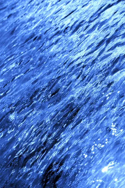 Photo of a macro background of beautiful blue sea water